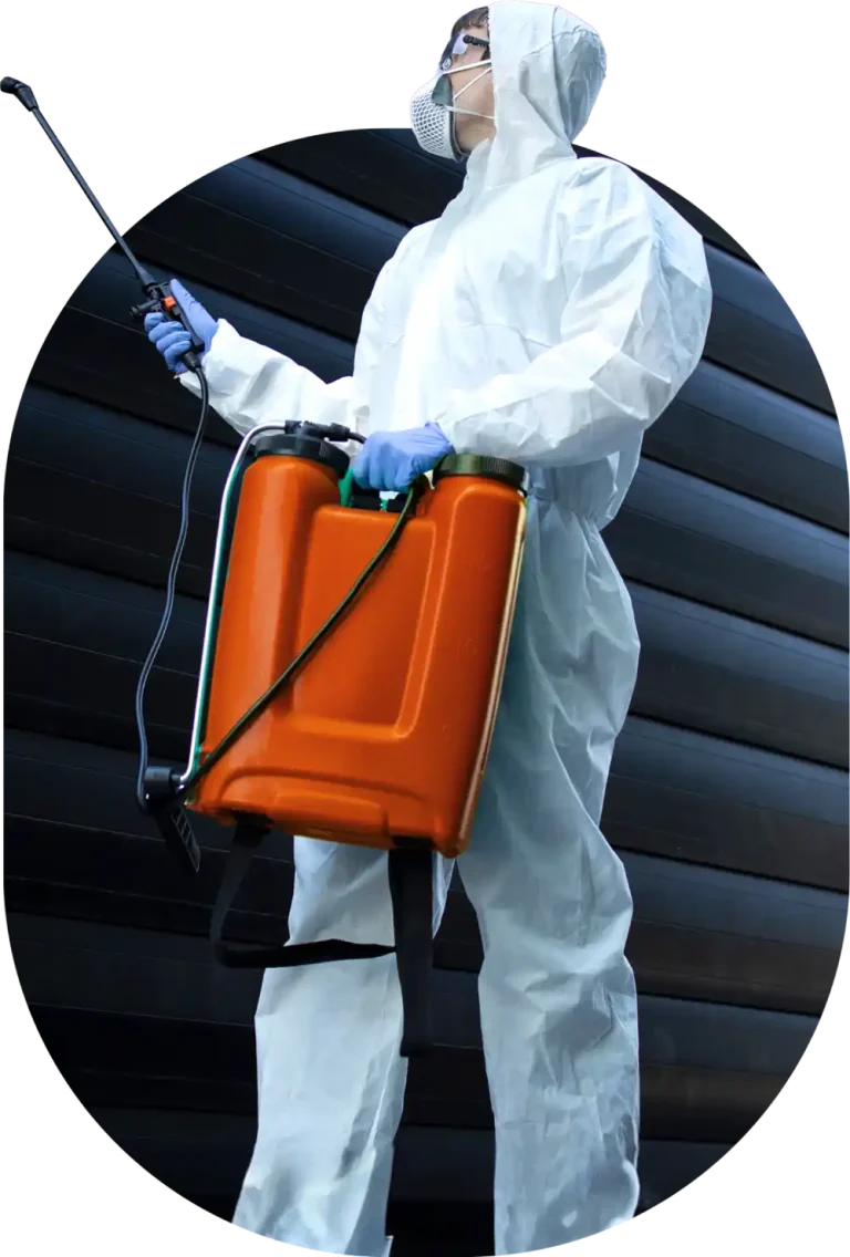 worker spraying with orange jug