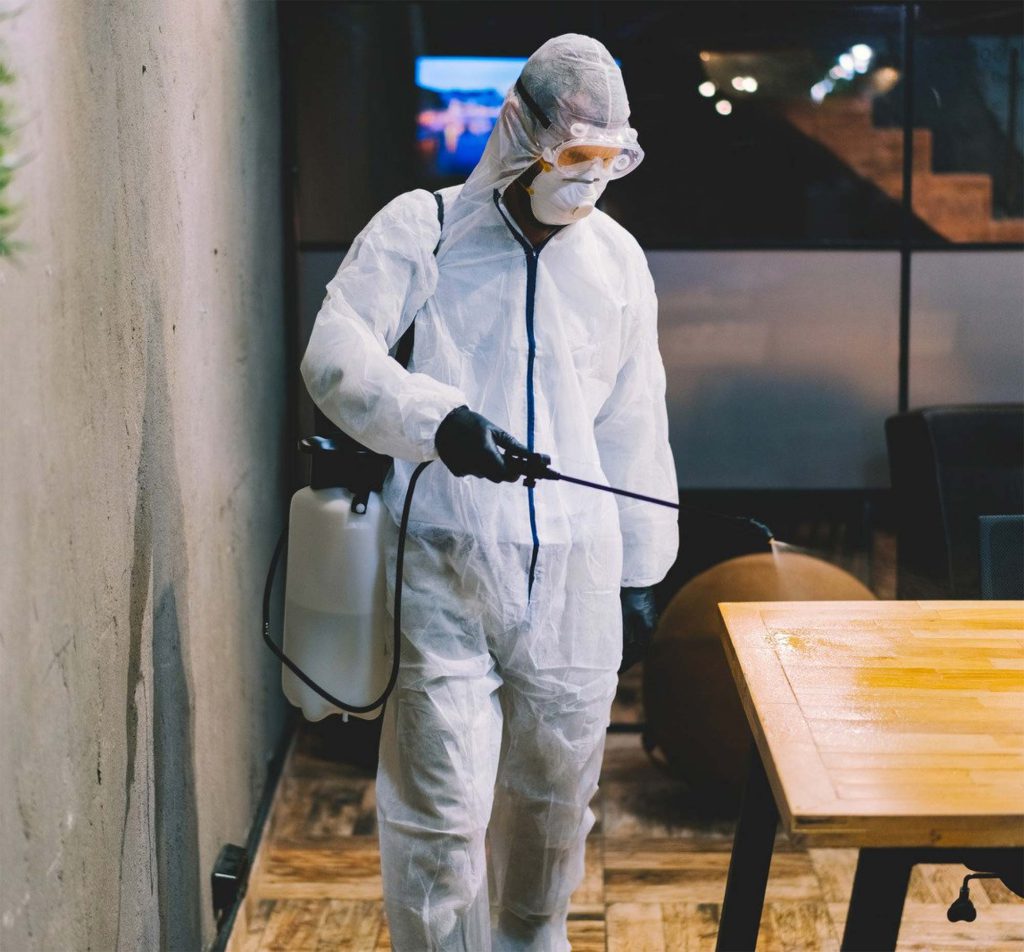 worker spraying table