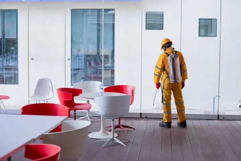 worker spraying in a lounge